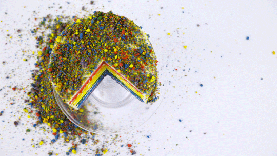 Stock footage: Rainbow Cake On White Table Top View 4K