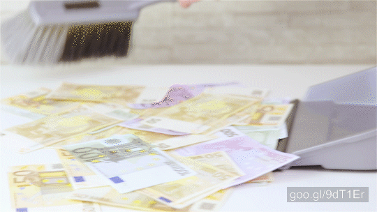 Stock Footage of Cleaning Up Money With Dustpan And Brush 4K
