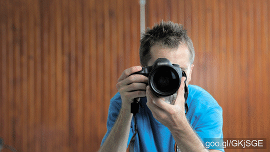 Stock Footage of Photographer Take Photo With Tele-Lens Portrait Shot 4K